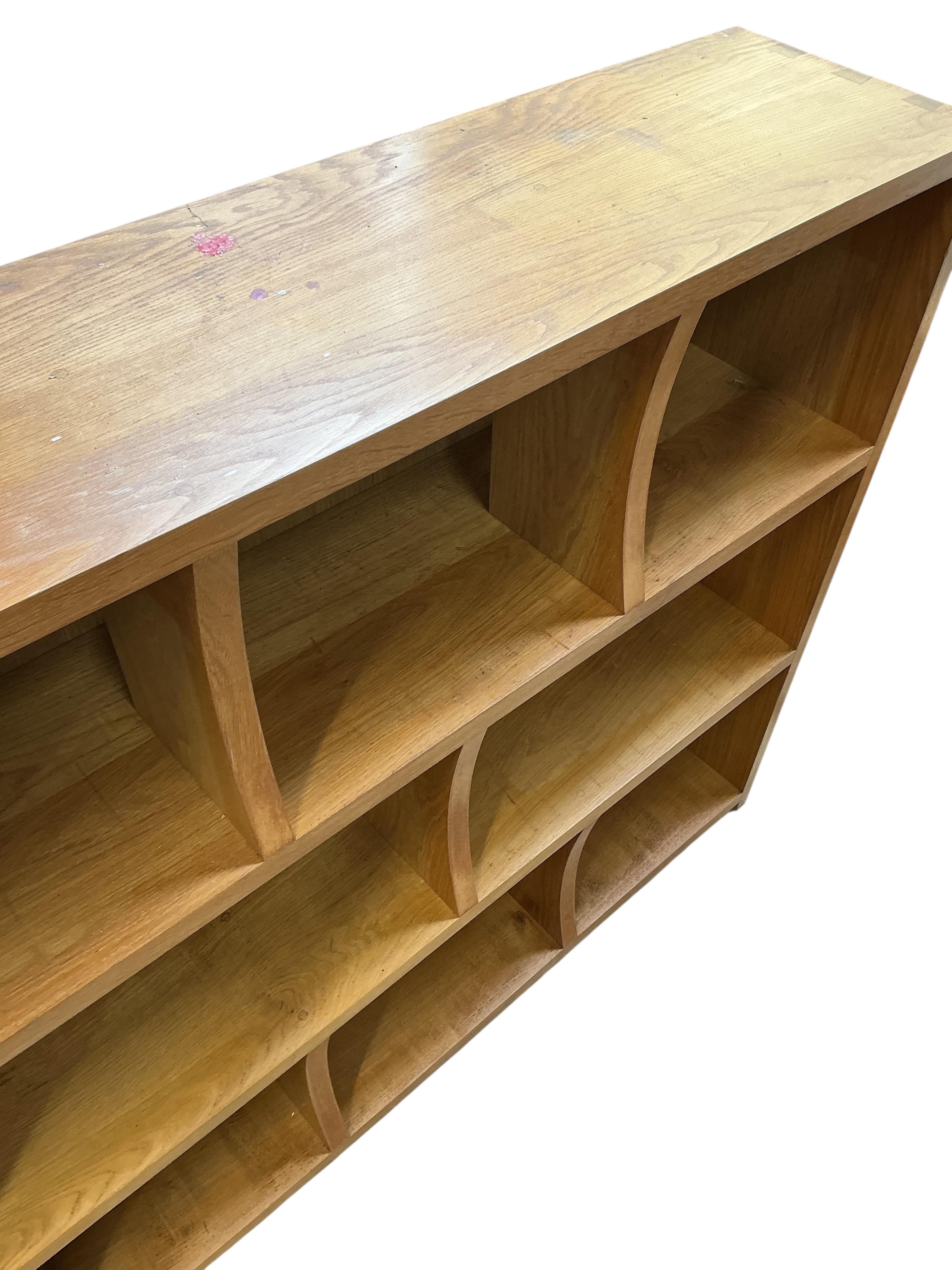 A pair of bespoke oak open bookcases, each width 132cm, depth 30cm, height 107cm